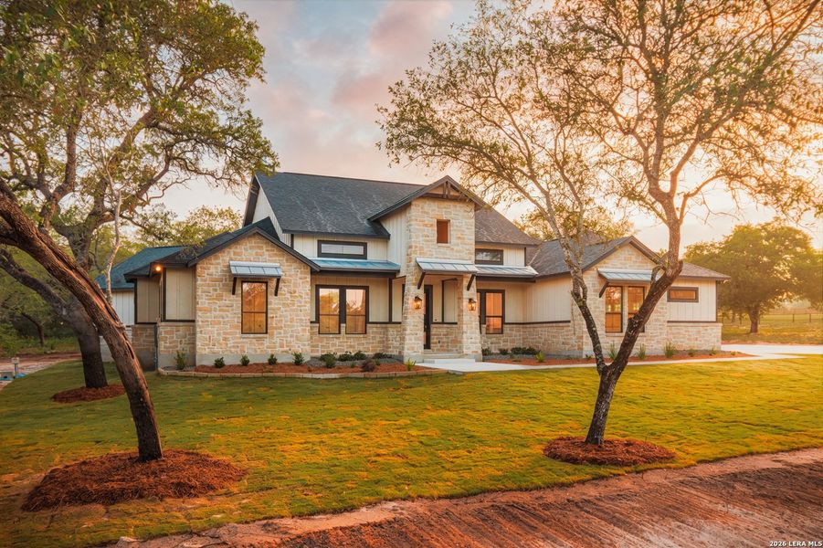 Front exterior of a new home in , La Vernia, TX, highlighting curb appeal (Image 21).