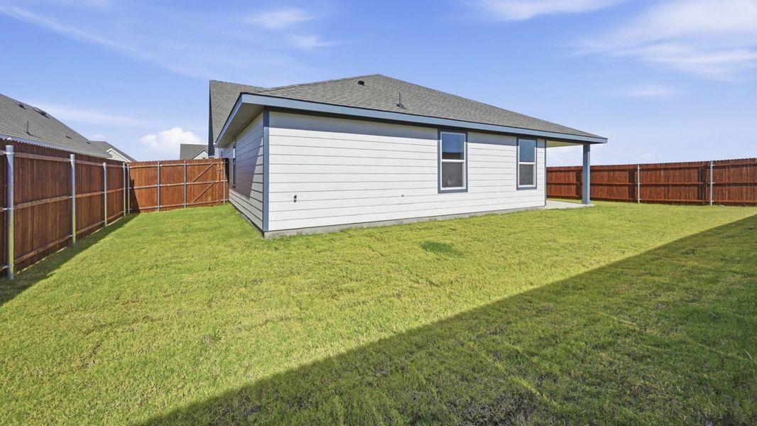 Exterior details and patio area of a home in Windrose, Pilot Point (Image 9).
