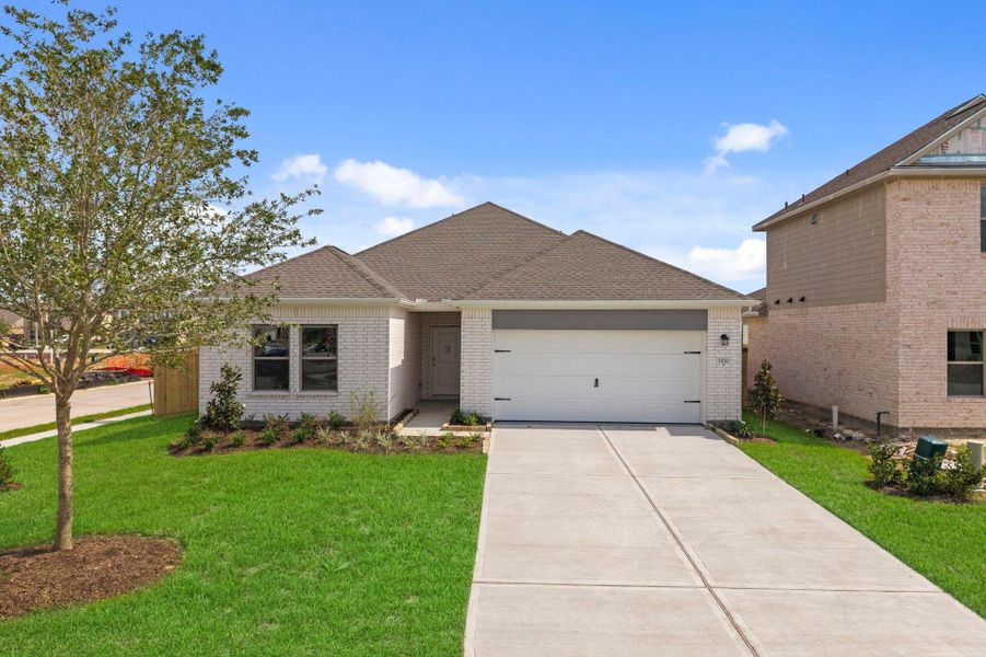 Front exterior of a new home in Windrose Green, Angleton, TX, highlighting curb appeal (Image 2). Front exterior of a new home in Windrose Green, Angleton, TX, highlighting curb appeal (Image 2).
