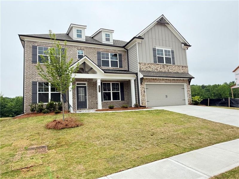 Front exterior of a new home in Ponderosa Farms Manor, Gainesville, GA, highlighting curb appeal (Image 29).
