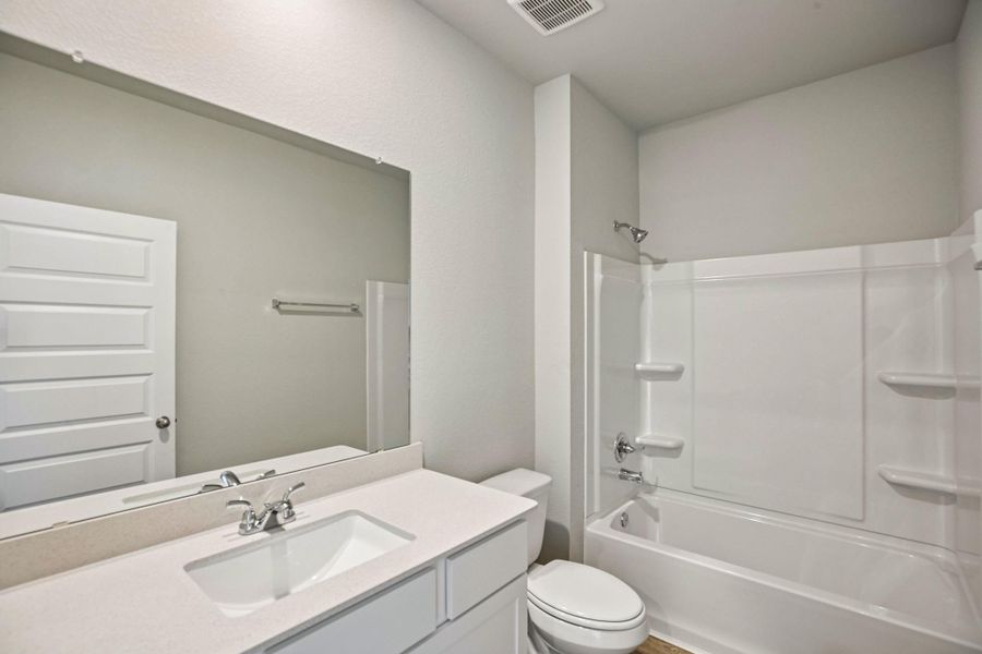 Furnished interior view inside a new home in Sorella, Tomball (Image 12).