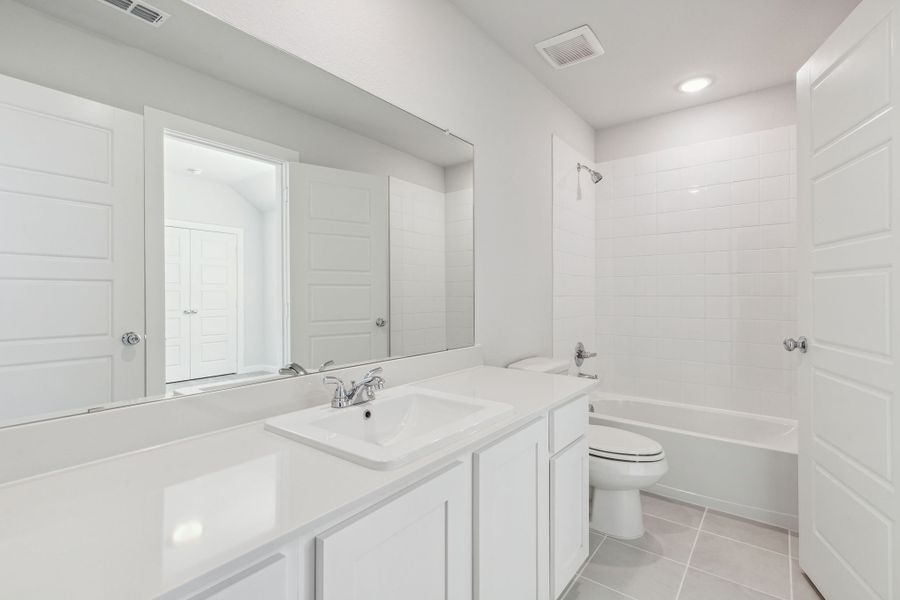 Bathroom in the Willow home plan by Trophy Signature Homes – REPRESENTATIVE PHOTO