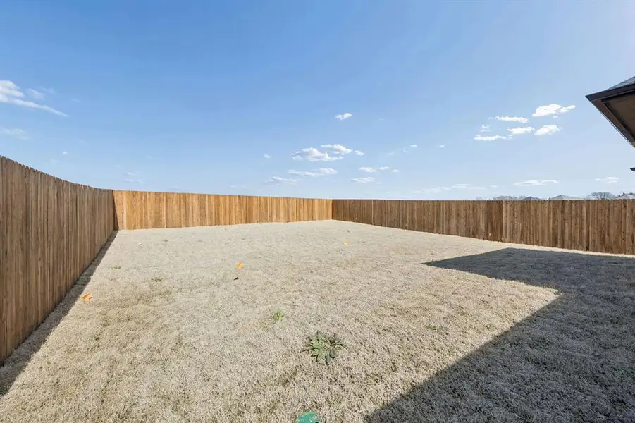 Covered Patio in the Oak II home plan by Trophy Signature Homes – REPRESENTATIVE PHOTO