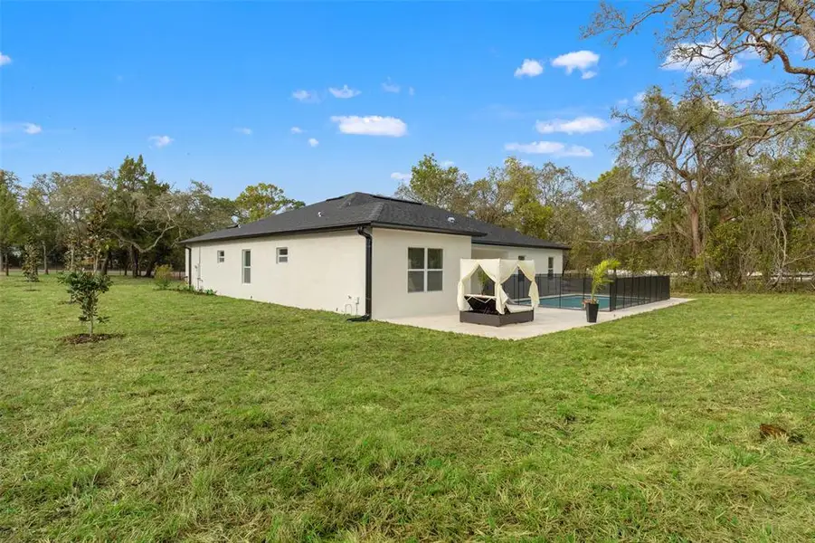 Exterior details and patio area of a home in , Spring Hill (Image 3). Exterior details and patio area of a home in , Spring Hill (Image 3).