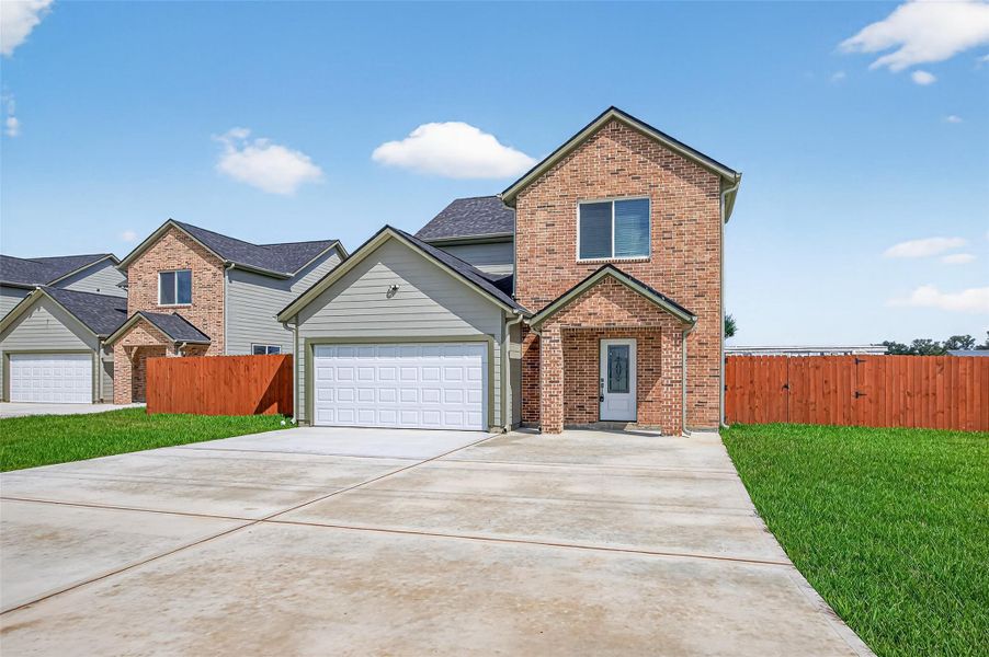 Front exterior of a new home in , Cleveland, TX, highlighting curb appeal (Image 1).