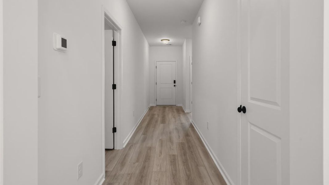 Spacious hallway provides easy access to secondary bedrooms