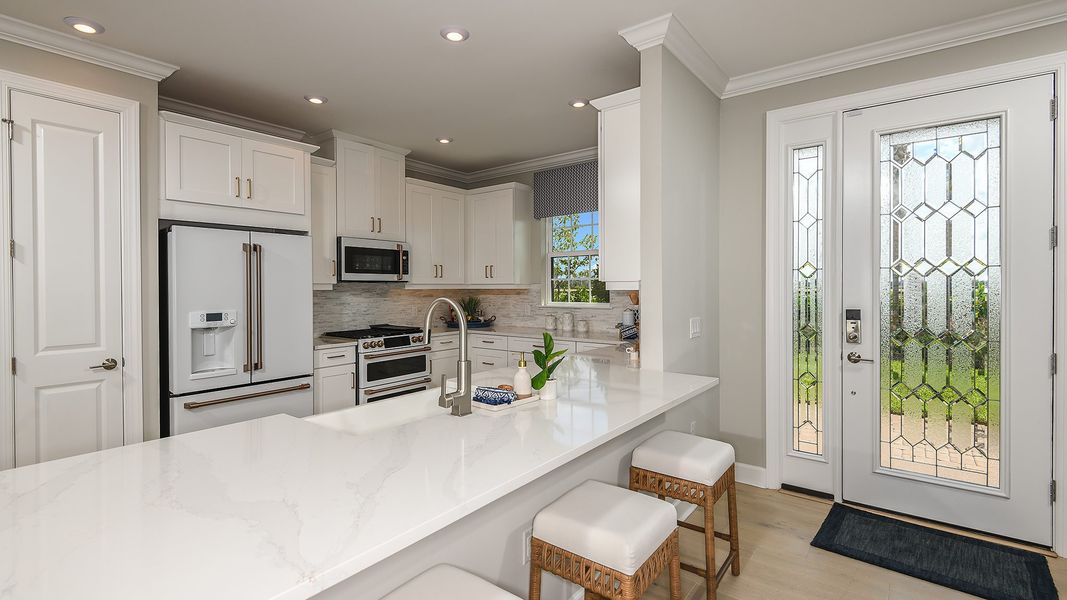 Furnished interior view inside a new home in Esplanade by the Islands, Naples (Image 5).