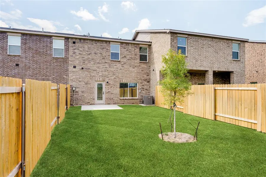 This is an example of the backyard at 449 MB's Way. All backyards are fenced, landscaped, and have a concrete patio. This is an example of the backyard at 449 MB's Way. All backyards are fenced, landscaped, and have a concrete patio.