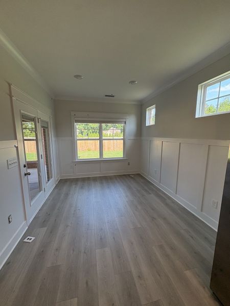 Dining room featuring upscale wainscoting and chair rail trim. Dining room featuring upscale wainscoting and chair rail trim.