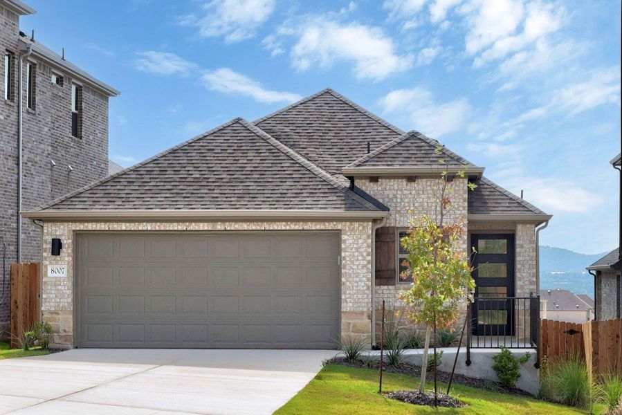 Front exterior of a new home in Lakeside at Tessera, Lago Vista, TX, highlighting curb appeal (Image 1). Front exterior of a new home in Lakeside at Tessera, Lago Vista, TX, highlighting curb appeal (Image 1).