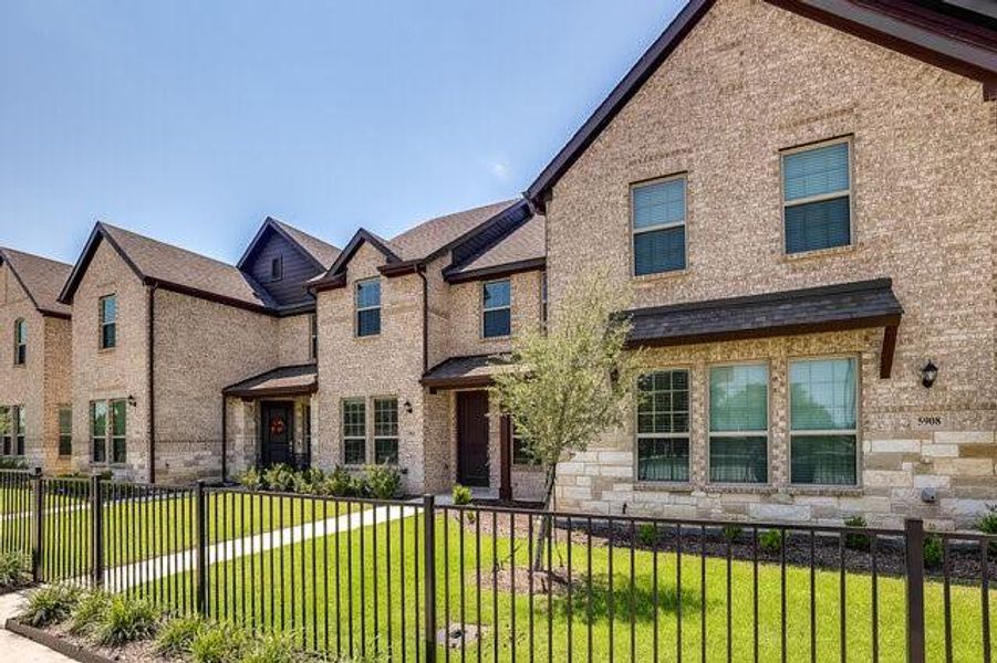 View of front of property with brick siding