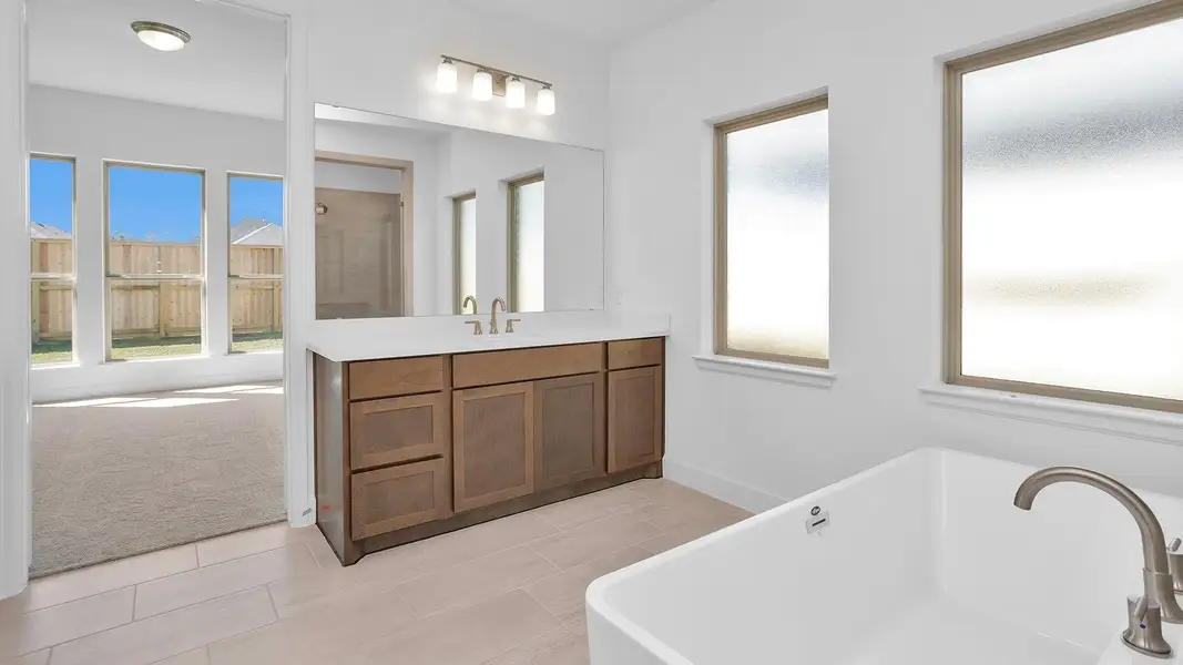 Furnished interior view inside a new home in Grand Central Park 45', Conroe (Image 5).