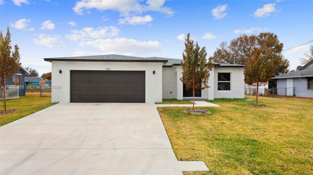 Front exterior of a new home in , Port St. Lucie, FL, highlighting curb appeal (Image 20). Front exterior of a new home in , Port St. Lucie, FL, highlighting curb appeal (Image 20).