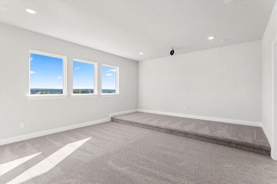 Spare room with carpet and recessed lighting