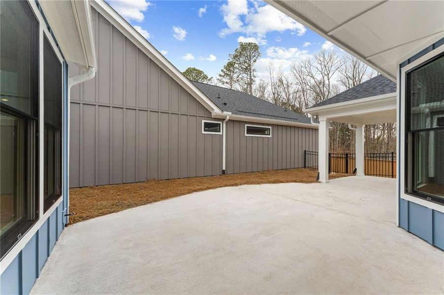 Exterior details and patio area of a home in The Courtyards at Redbud Lane, Holly Springs (Image 4).
