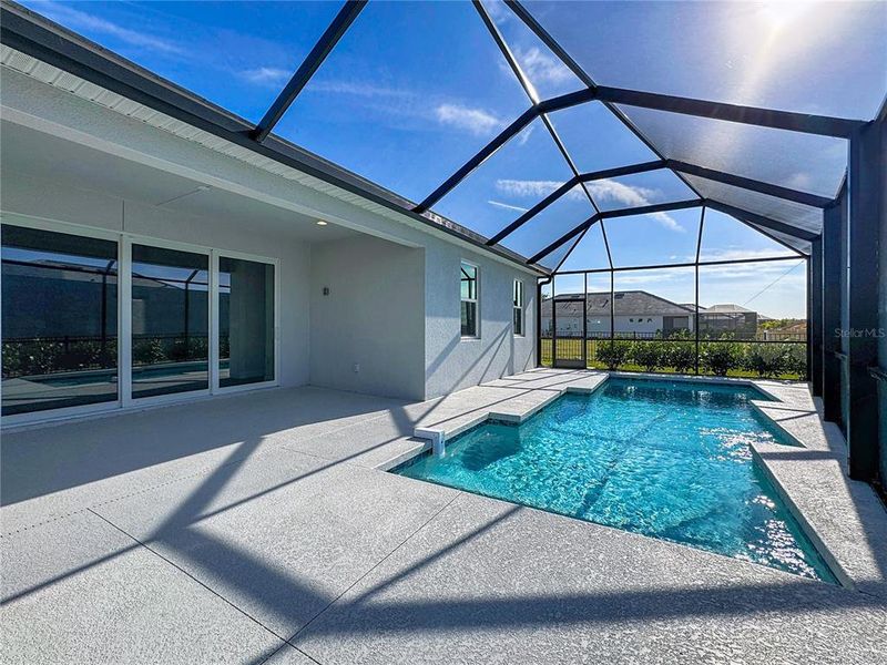 Exterior details and patio area of a home in Watercolor Place, Bradenton (Image 30).