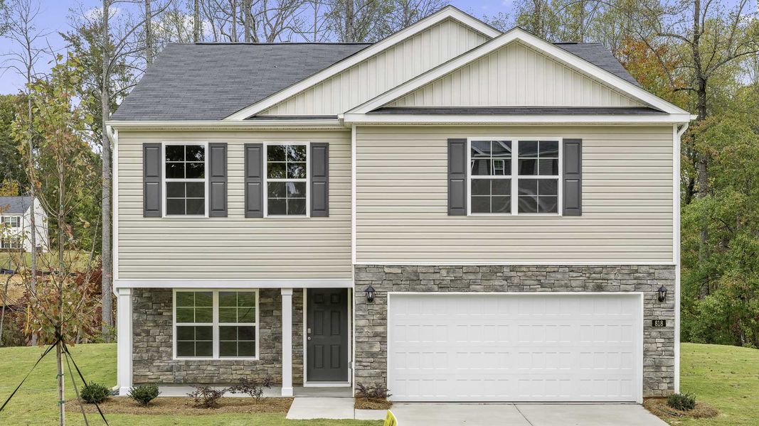 Front exterior of a new home in Waverly Place, Linwood, NC, highlighting curb appeal (Image 1). Front exterior of a new home in Waverly Place, Linwood, NC, highlighting curb appeal (Image 1).