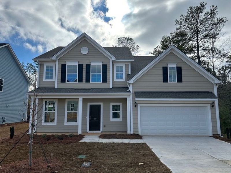 Front exterior of a new home in Pebble Branch, Chapin, SC, highlighting curb appeal (Image 1). Front exterior of a new home in Pebble Branch, Chapin, SC, highlighting curb appeal (Image 1).