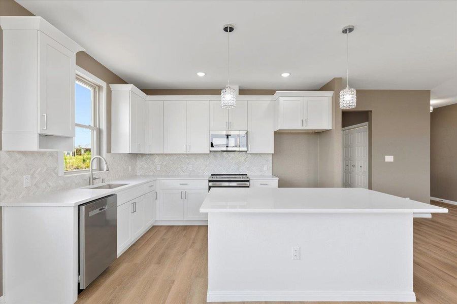 A well-appointed kitchen features stainless steel appliances A well-appointed kitchen features stainless steel appliances