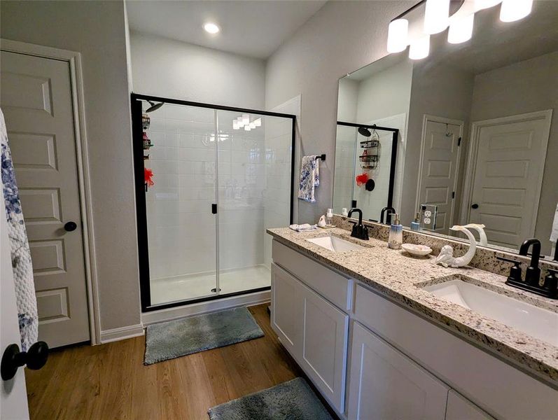 Beautiful Primary Bathroom with dual vanity and standing shower