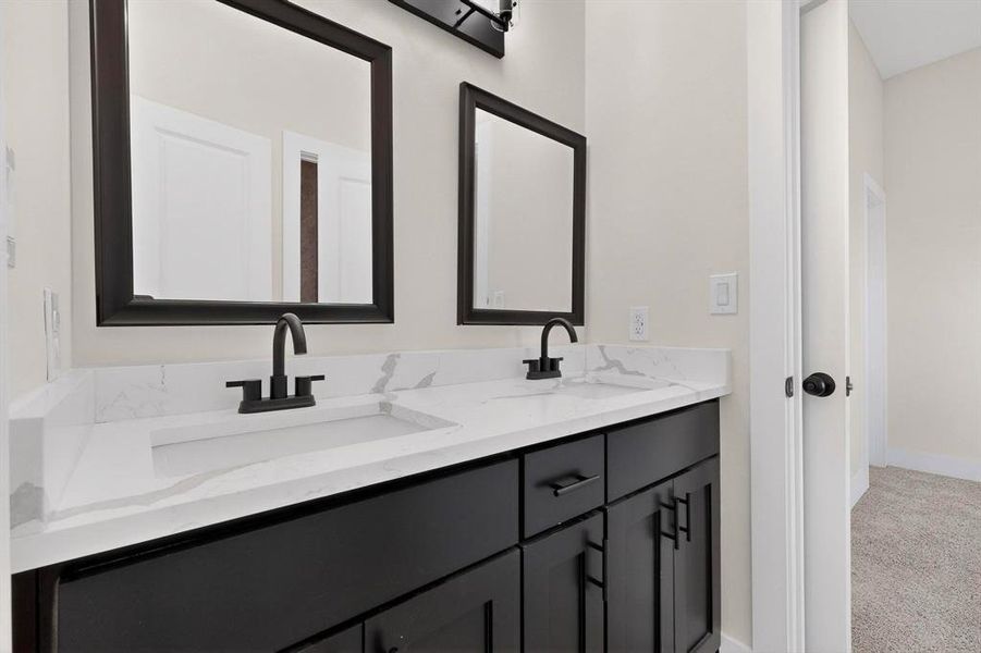 Jack and Jill Bathroom shared by two of the secondary bedrooms Jack and Jill Bathroom shared by two of the secondary bedrooms