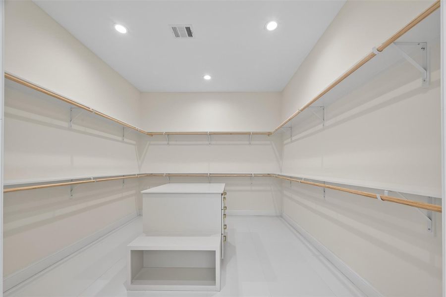 Step Into Your Dream Closet – Spacious 11' x 13' walk-in featuring  self-closing drawers, and hanging space designed for both style and organization.