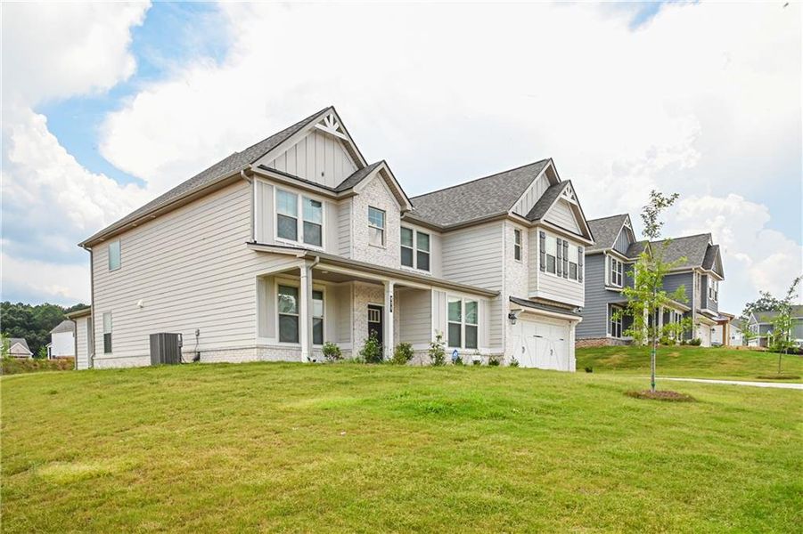 Front exterior of a new home in , Stockbridge, GA, highlighting curb appeal (Image 33).