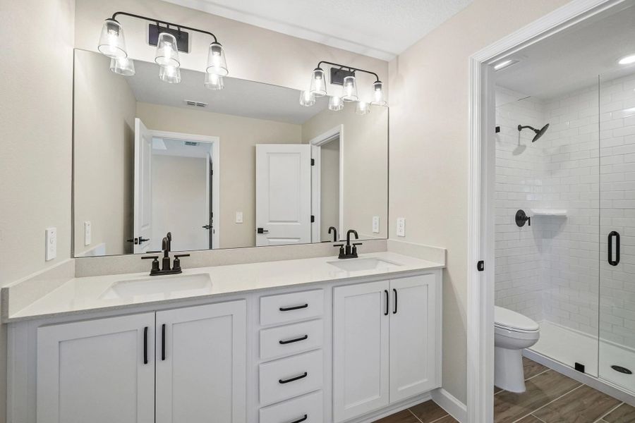 Primary bathroom features aspects of AW Collection® Harmony and double sinks