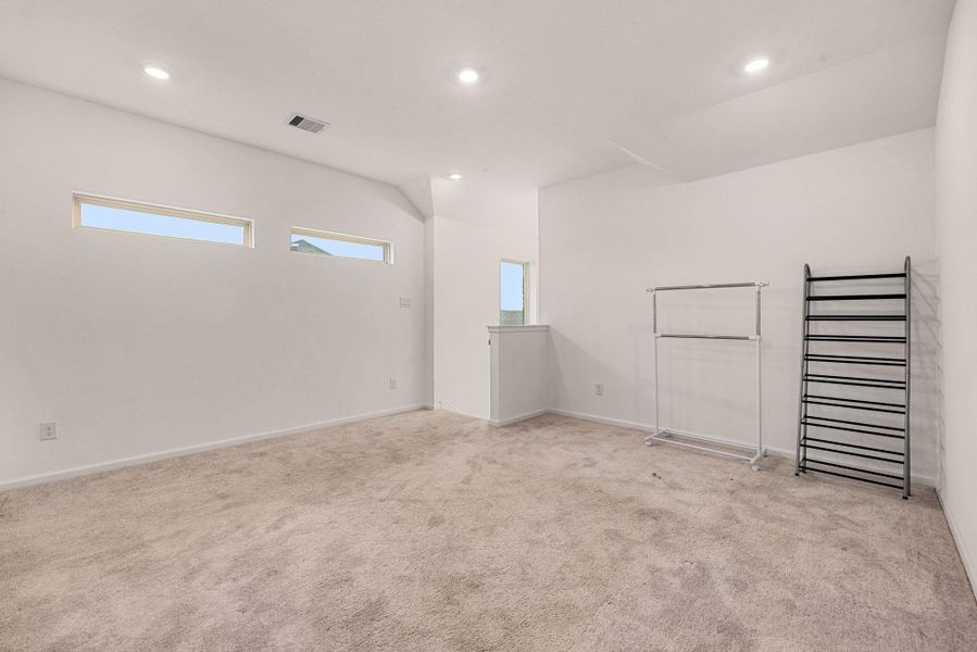 Spacious, unfurnished interior of a new home in Sunterra, Katy (Image 37).