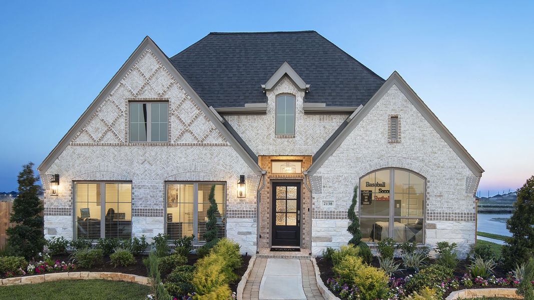 Front exterior of a new home in Meadows of Mill Creek, Seguin, TX, highlighting curb appeal (Image 20).