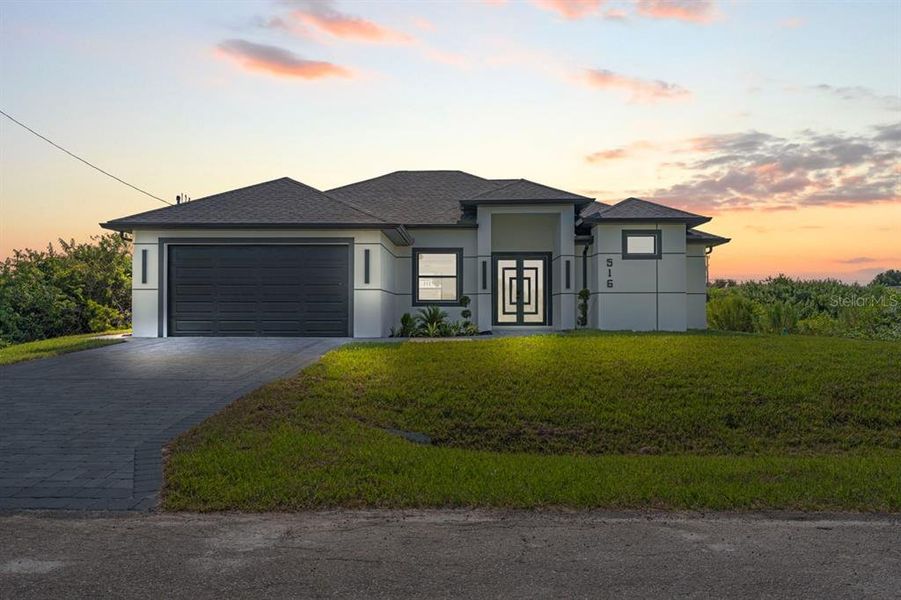 Front exterior of a new home in , Lehigh Acres, FL, highlighting curb appeal (Image 2). Front exterior of a new home in , Lehigh Acres, FL, highlighting curb appeal (Image 2).