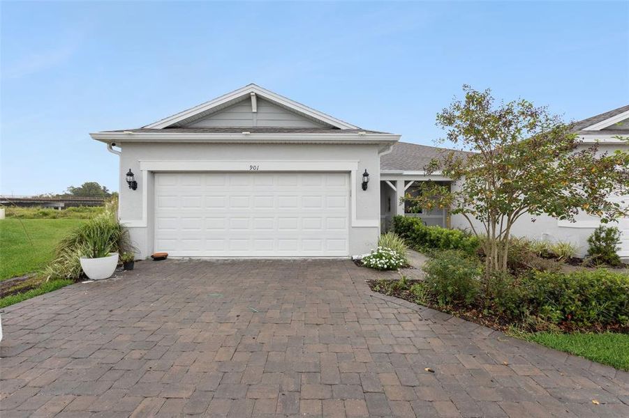 Front exterior of a new home in , Kissimmee, FL, highlighting curb appeal (Image 1).