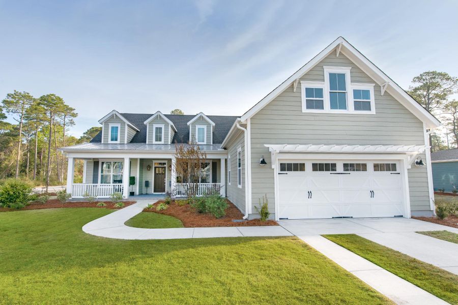 Representative exterior photo of a completed home built from the McKinley by Bill Clark Homes in The Sanctuary at Sunset Beach, Sunset Beach, NC (Image 25). Representative exterior photo of a completed home built from the McKinley by Bill Clark Homes in The Sanctuary at Sunset Beach, Sunset Beach, NC (Image 25).
