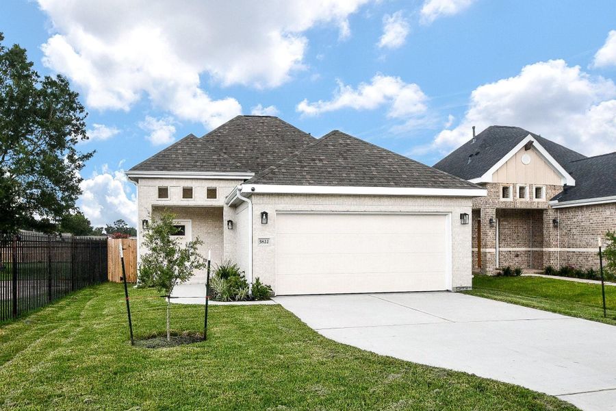 Front exterior of a new home in , Houston, TX, highlighting curb appeal (Image 23).