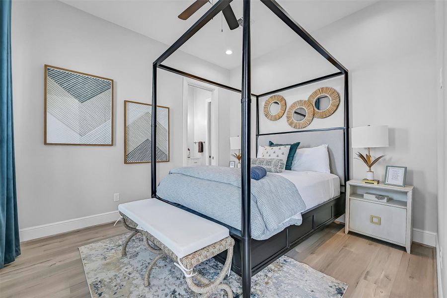 The main floor bedroom feels calm, comfortable, and thoughtfully designed with natural light and clean finishes. There’s plenty of room to create your own retreat.