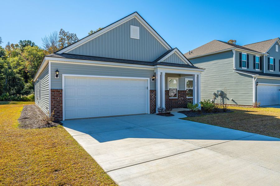 Front exterior of a new home in Cedar Glen Preserve, Huger, SC, highlighting curb appeal (Image 19).