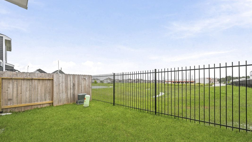 Exterior details and patio area of a home in Bridges on Lake Houston Villas, Humble (Image 3).