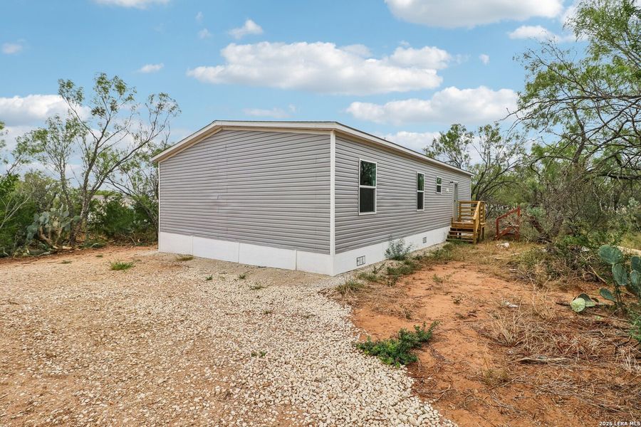 Exterior details and patio area of a home in , Devine (Image 22). Exterior details and patio area of a home in , Devine (Image 22).