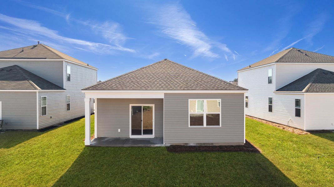 Exterior details and patio area of a home in Pine Hills at Cane Bay, Summerville (Image 3). Exterior details and patio area of a home in Pine Hills at Cane Bay, Summerville (Image 3).