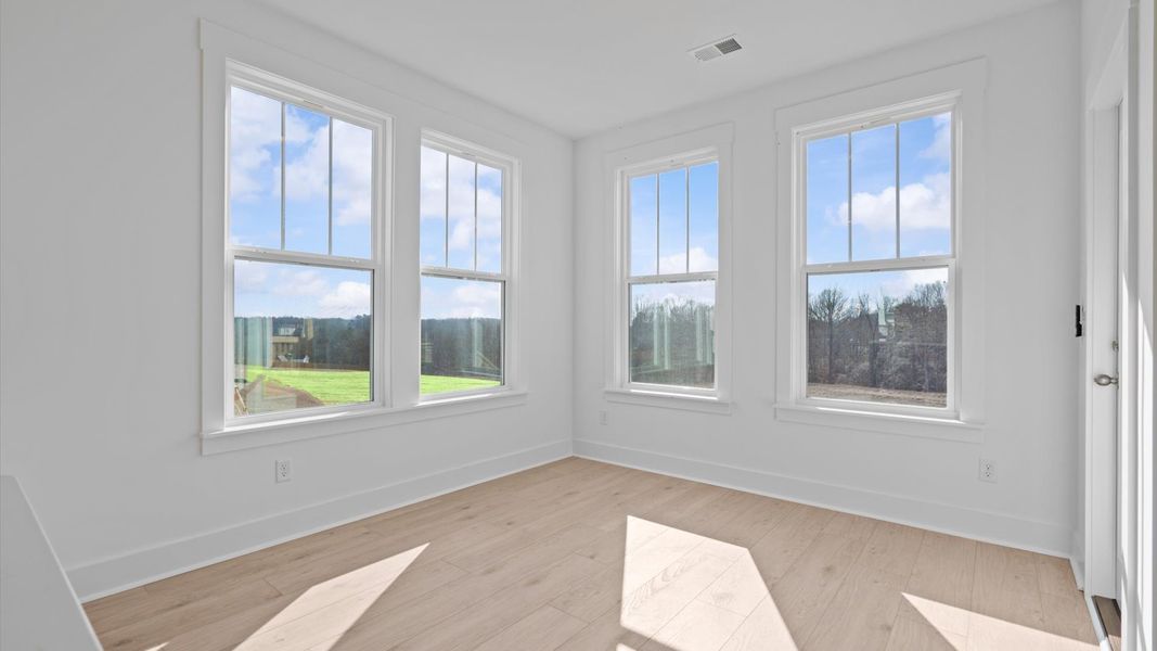 This eye-catching breakfast area provides a comfortable and stylish setting for daily meals.