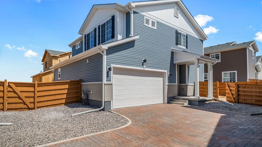 Exterior details and patio area of a home in Reunion, Commerce City (Image 23).