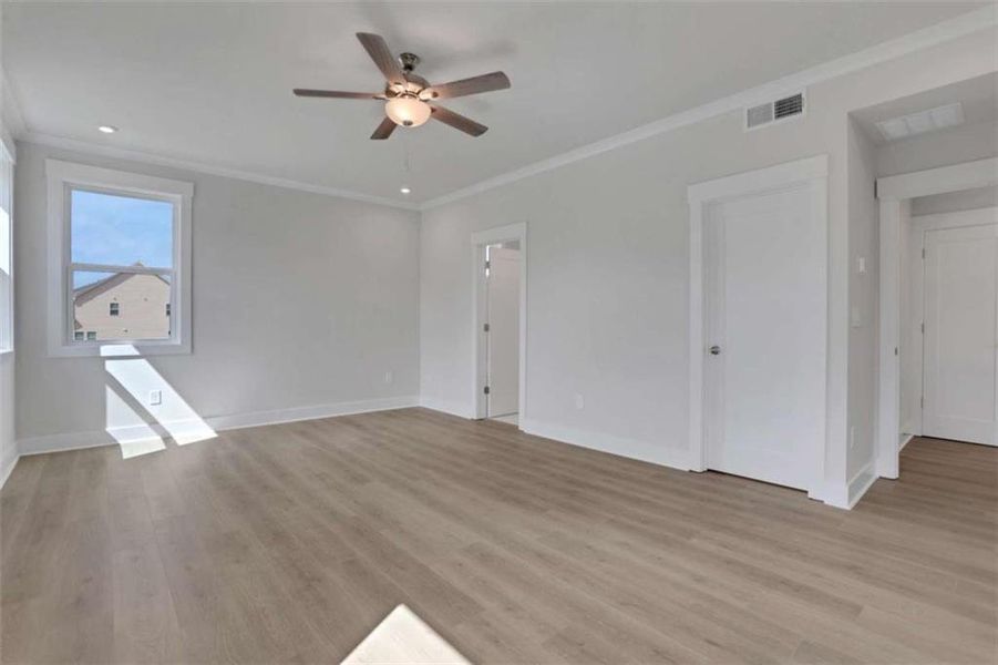 Spacious, unfurnished interior of a new home in The Paddocks at Doc Hughes, Buford (Image 31).