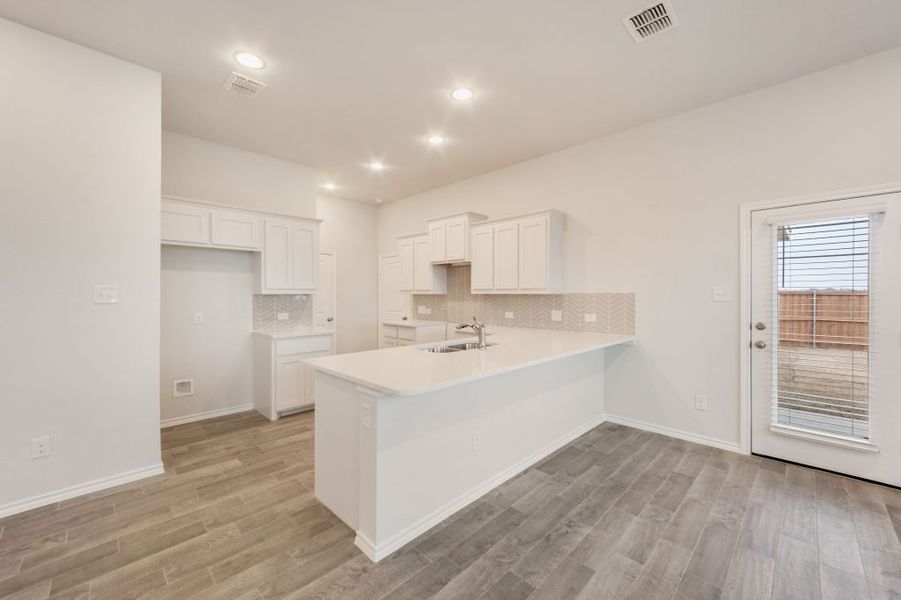 Representative exterior photo of a completed home built from the Joliet by Impression Homes in Heartland, Heartland, TX (Image 7).