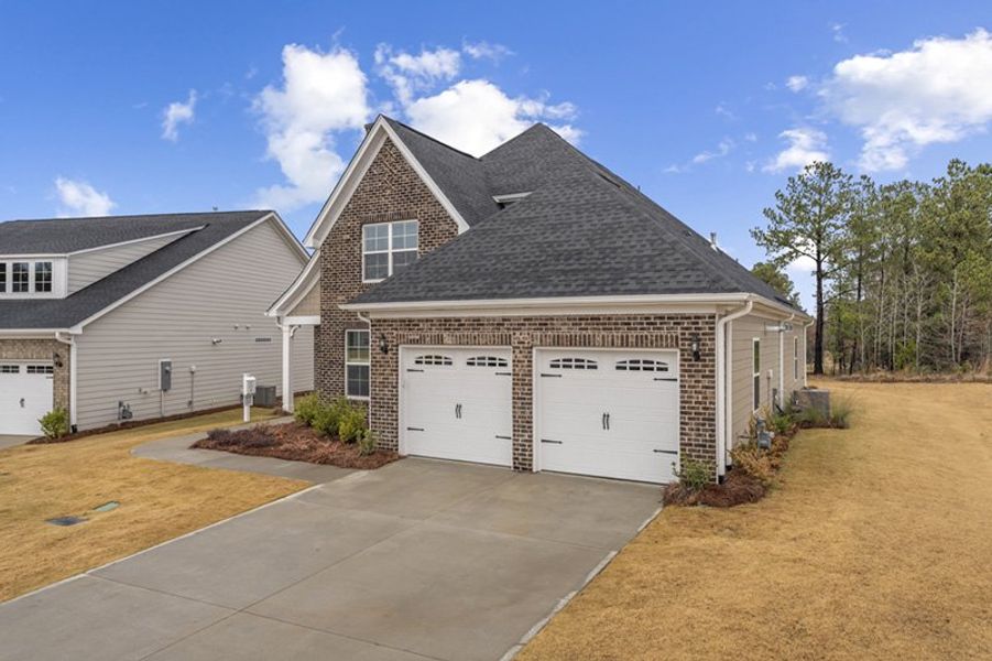 Front exterior of a new home in Taylor Oaks, Greenville, SC, highlighting curb appeal (Image 21).