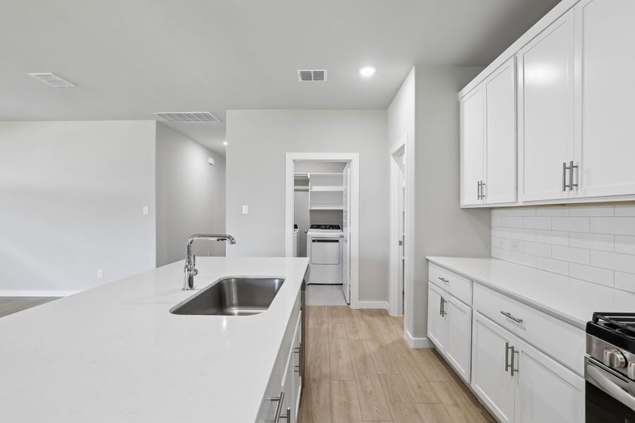 Kitchen in the Oscar home plan by Trophy Signature Homes