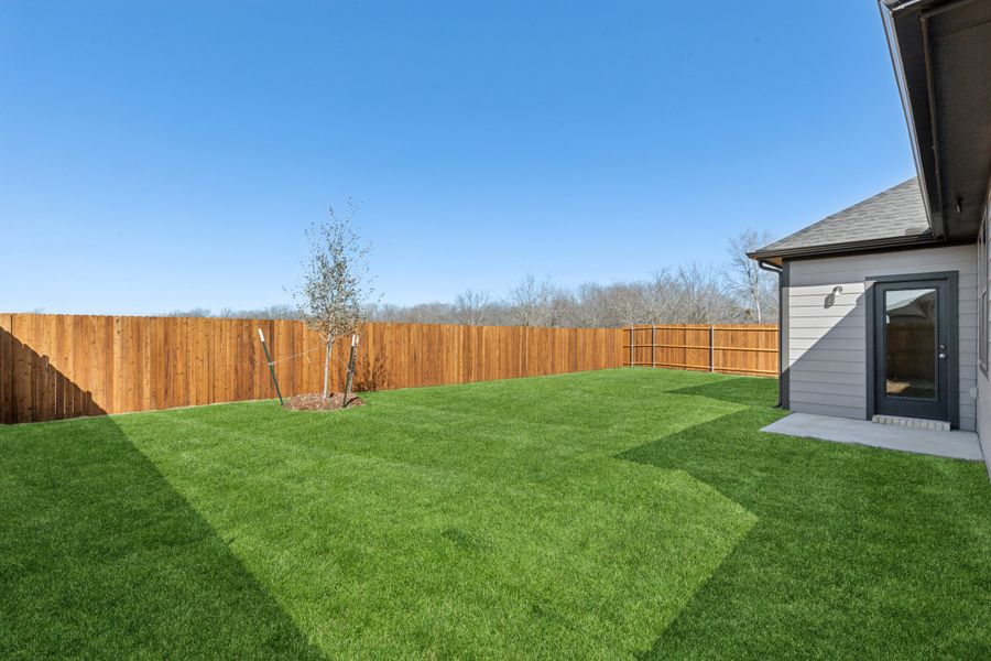 Patio in the Holden home plan by Trophy Signature Homes – REPRESENTATIVE PHOTO