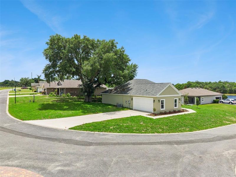Front exterior of a new home in , Umatilla, FL, highlighting curb appeal (Image 25). Front exterior of a new home in , Umatilla, FL, highlighting curb appeal (Image 25).