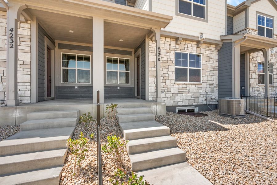 Exterior details and patio area of a home in The Lakes at Centerra, Loveland (Image 2).