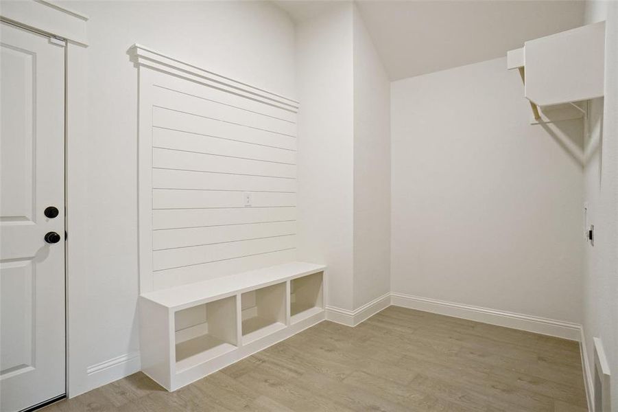 Mudroom with light wood-type flooring