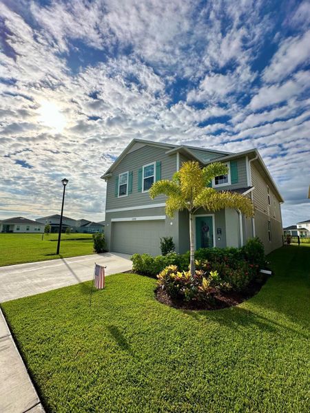 Front exterior of a new home in , Port St. Lucie, FL, highlighting curb appeal (Image 29).